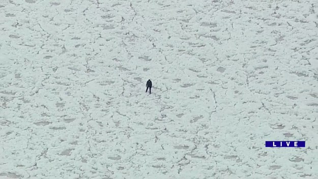 Man walks on frozen Lake Michigan in Chicago gets rescued.