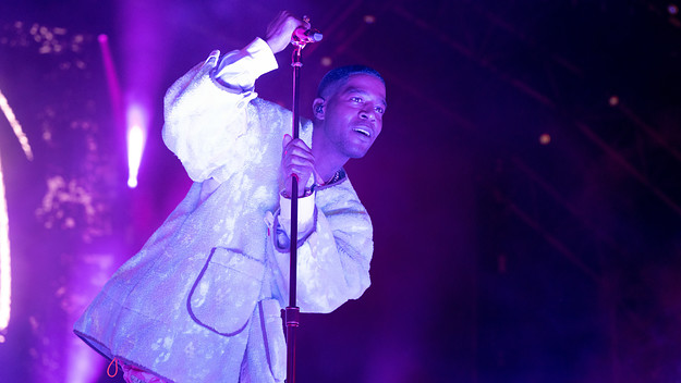 Kid Cudi performs for the crowd at a festival