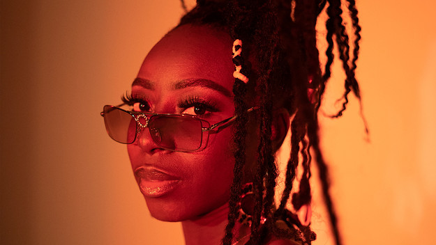 Zenesoul in an orange light with sunglasses
