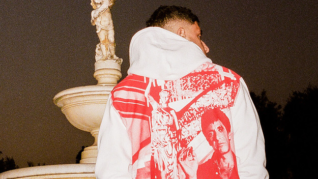 Model wearing a white hoodie with Tony Montana (Al Pacino) pictured in red.
