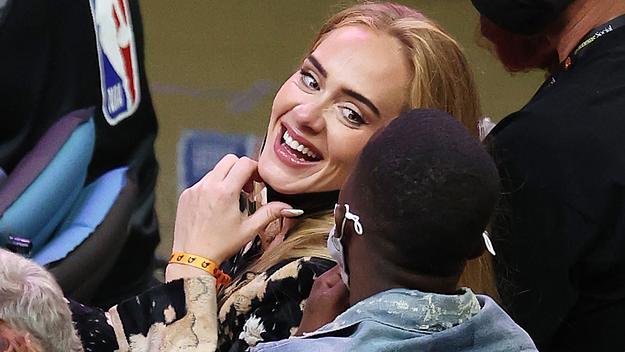 Singer Adele smiles with Rich Paul during the NBA Finals