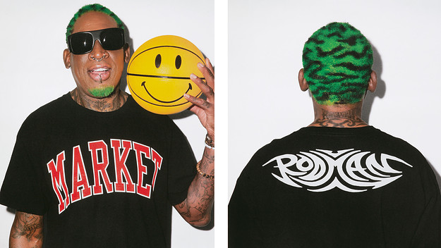 Dennis Rodman poses with a basketball