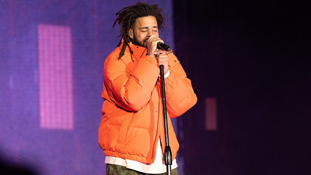 J Cole is seen performing at a festival