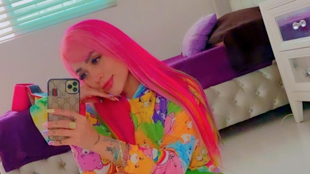 An influencer is pictured taking a selfie
