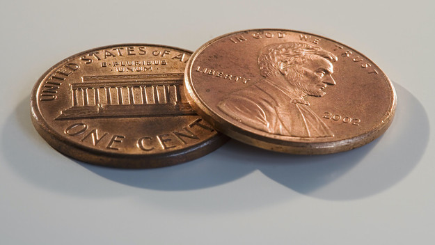 A stock photo of two pennies close up.