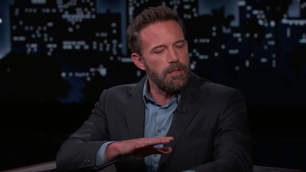 Ben Affleck is pictured wearing a blazer and speaking