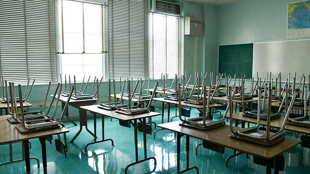 An empty classroom is seen.
