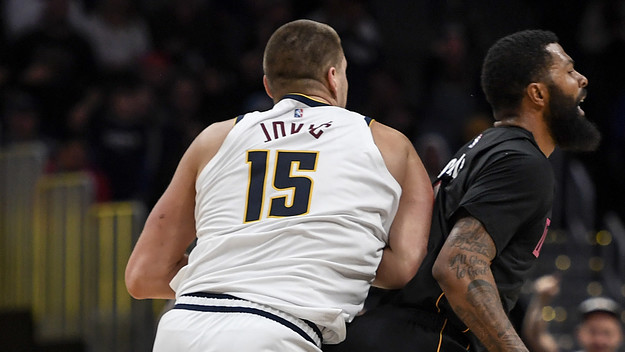Nikola Jokic (15) of the Denver Nuggets hits Markieff Morris (8) of the Miami Heat.