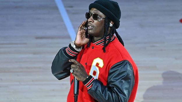 Young Thug performing at a Hawks game.