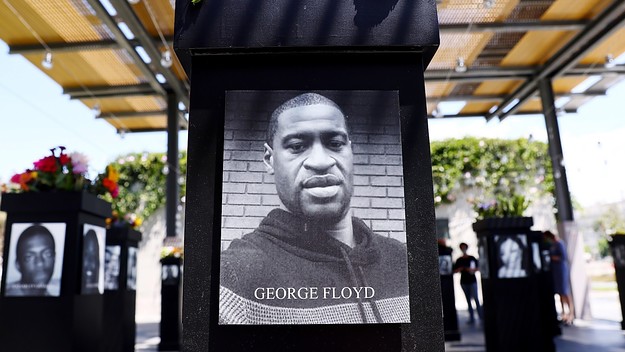 Floyd photo is displayed along with other photographs at the Say Their Names memorial