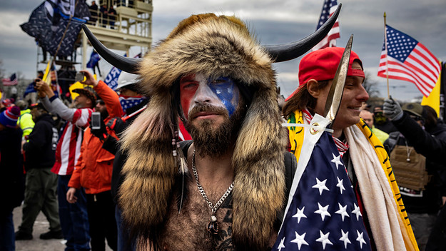 A rioter in costume is seen at the Capitol.