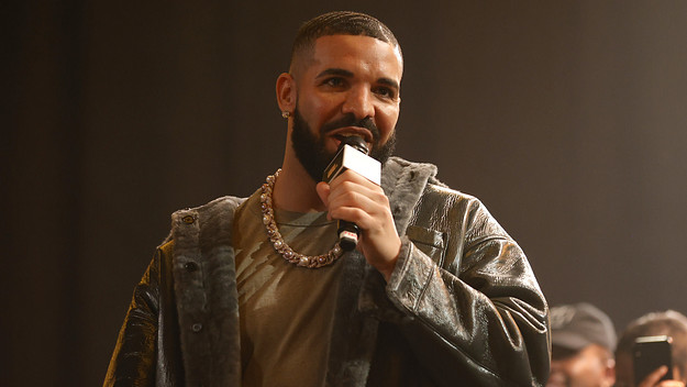 Drake on the mic in a jacket