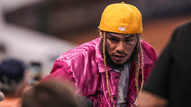 Tekashi 6ix9ine is at a baseball game.
