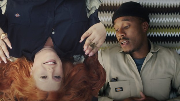 Winnipeg rapper Anthony OKS and indie singer Begonia laying beside eachother in the Fortified Bond music video.