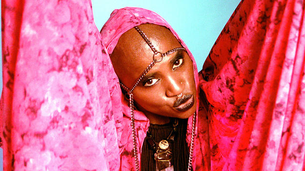Toronto artist SATE poses in pink robe