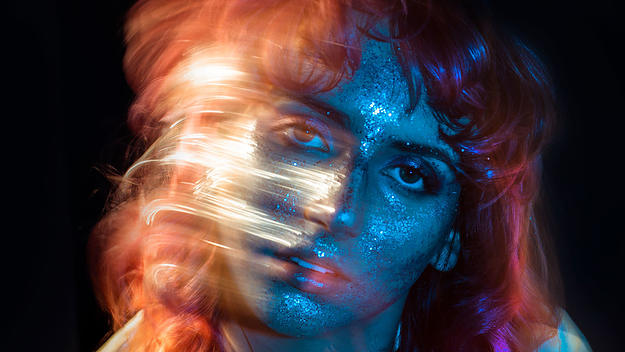 Hallie Tut posing in glitter