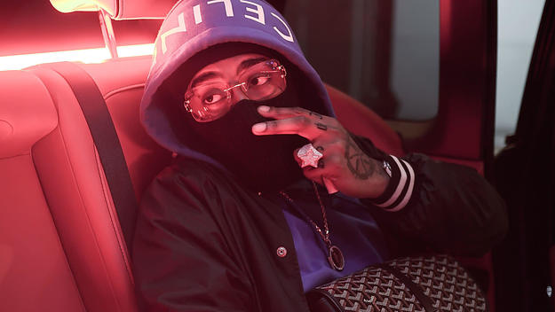 Northside Benjii poses in a hoodie and balaclava