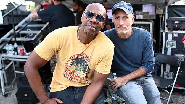 Dave Chappelle and Jon Stewart pose for photo together during Dave Chappelle's Block Party.