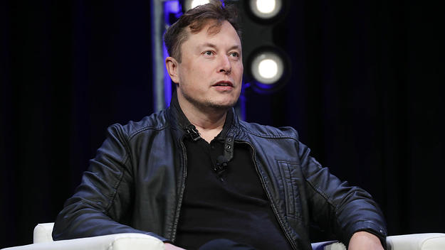 Tesla CEO and founder Elon Musk speaking onstage at a conference