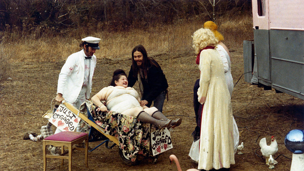 Paul Swift carrying Edith Massey on a barrow in the film 'Pink Flamingos'; really disturbing movies