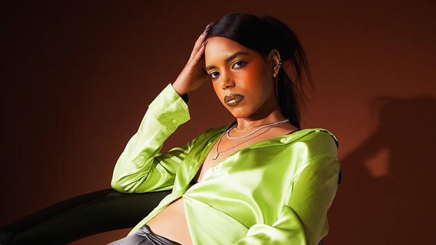 Model in green top and necklaces