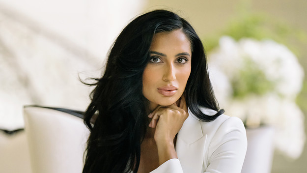 Nisha Grewal in a white suit