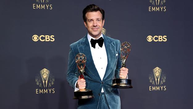 Jason Sudeikis holds Emmy Awards