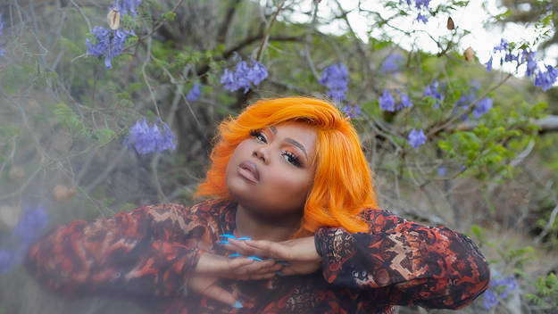Rising Toronto artist LU KALA posts in a park