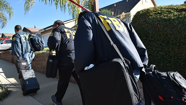 FBI investigators arrive at the home of suspected nightclub shooter Ian David Long.