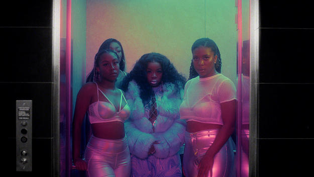 Charmaine in the music video in a furry outfit