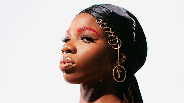 Haviah Mighty in a black headscarf