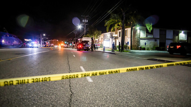Police tape cordons off the building where the shooting occurred.