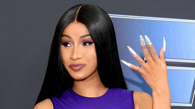 cardi face tat