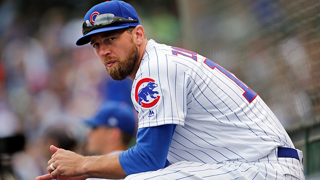 Ben Zobrist sits in the dugout during the game against the Milwaukee Brewers.