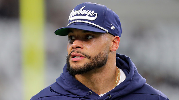 Dak Prescott on the field during warm ups before the game