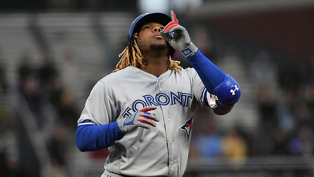 Vladimir Guerrero Jr. #27 of the Toronto Blue Jays reacts after hitting a single in the second inning of their MLB game at Oracle Park on May 14, 2019 in San Francisco, California.