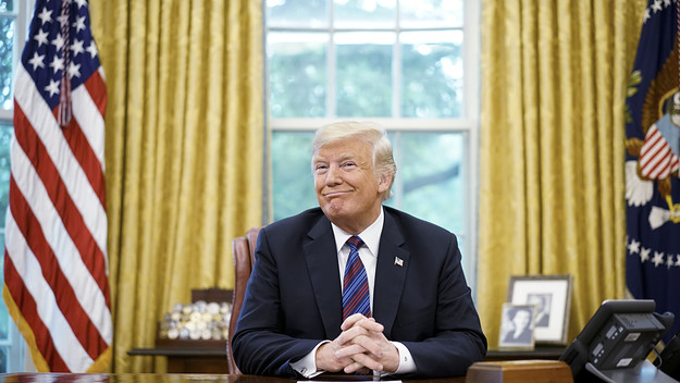 Donald Trump smiles during a phone conversation with Mexico's President Enrique Pena Nieto.