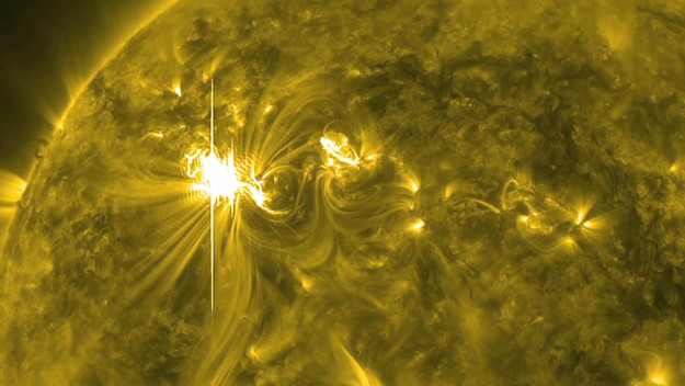 a X5.4 solar flare, the largest in five years, erupts from the sun's surface.