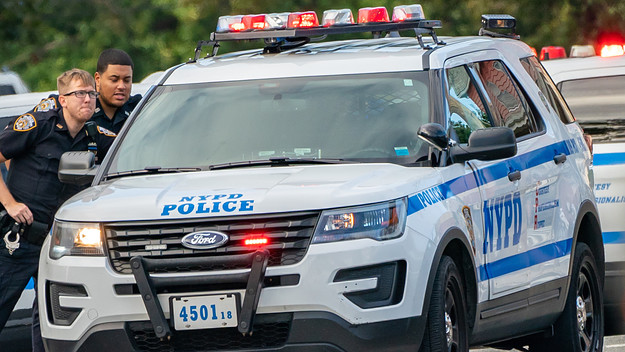 NYPD officers seen on the shooting scene. Police from 109th Precinct, Queens