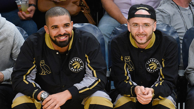 Drake (L) and Noah Shebib attend a basketball game