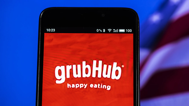 In this photo illustration, the GrubHub logo seen displayed on a smartphone.