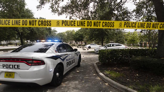 Police tape marks off the entrance