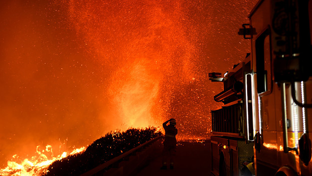 California firefighter watching fire tornado.
