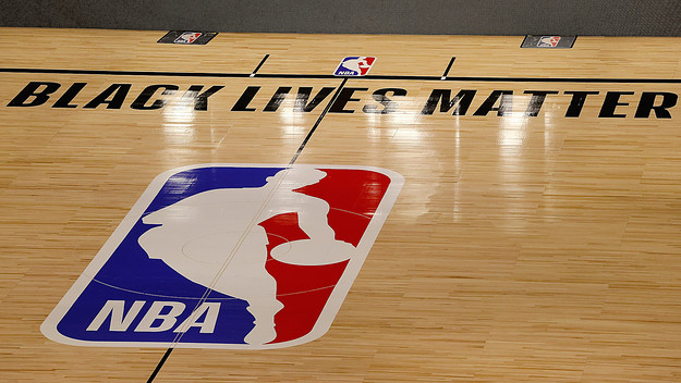 The Black Lives Matter logo is seen on an empty court