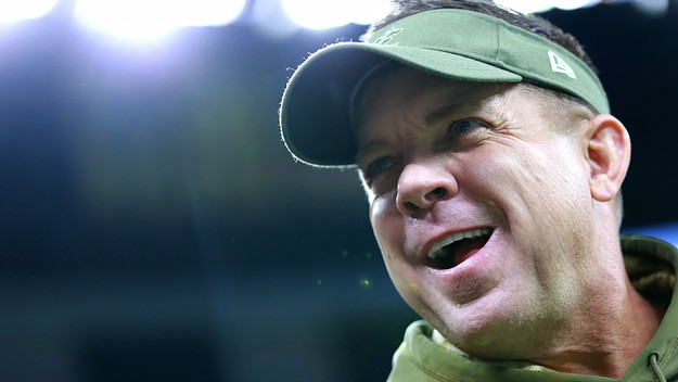 Head coach Sean Payton stands on the field
