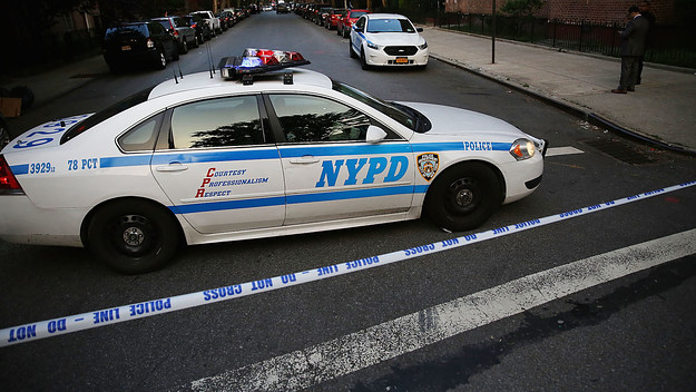 police car is parked at a crime scene