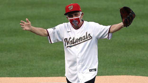 Dr. Anthony Fauci reacts after throwing out the ceremonial first pitch.