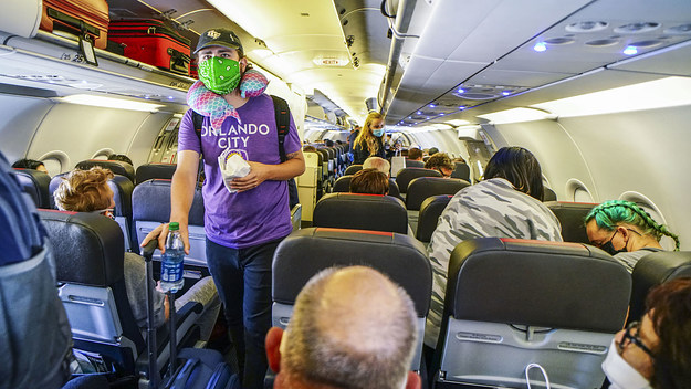 Passengers board American Airlines flight to Charlotte at San Diego International Airport.
