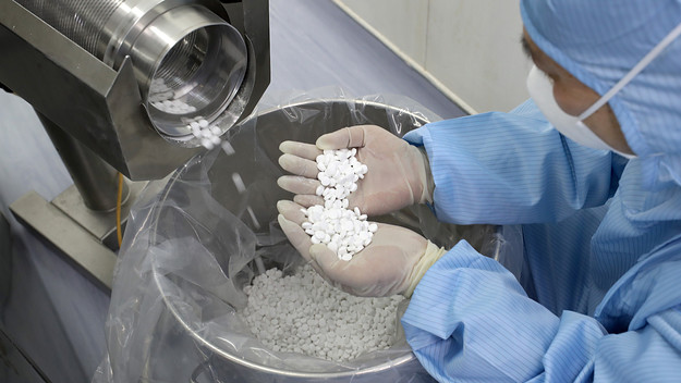 Employee checks the production of chloroquine phosphate in a pharmaceutical company.