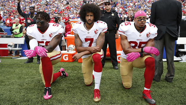Eli Harold #58, Colin Kaepernick #7 and Eric Reid #35 of the San Francisco 49ers